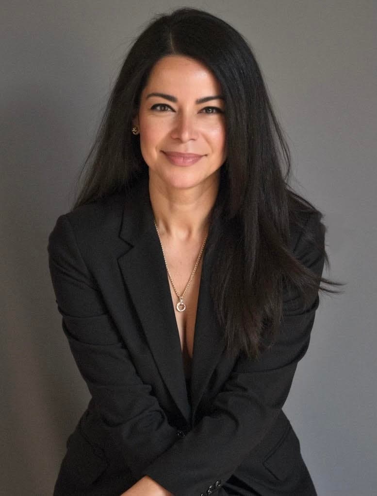 Wendy Ledesma, PA, smiling, in a black blazer against a grey backdrop.